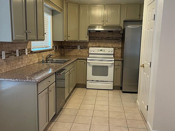 Great kitchen with dishwasher, new refrigerator, plenty of cabinet space, and pantry