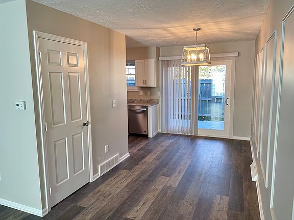 Brand new sliding door leads to roomy fenced patio.