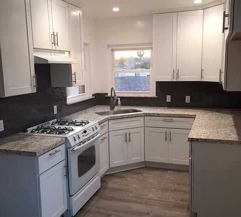 New Kitchen Cabinets, Quartz counter Tops, and Laminate Flooring