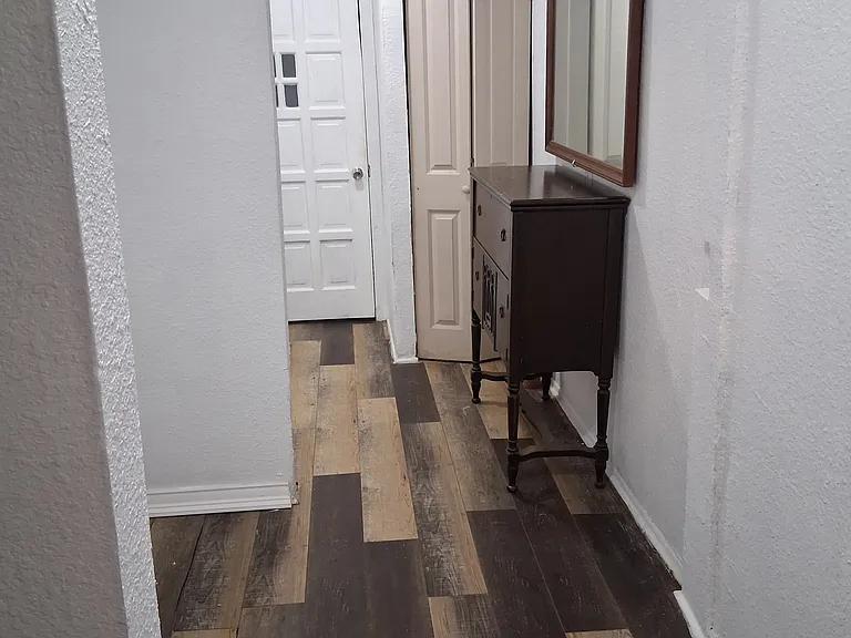 hall/laundry view from middle bedroom doorway