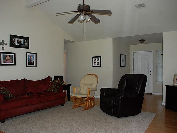 another view of family room.  Hallway leading to bedrooms.