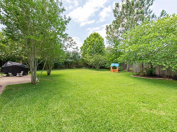 This incredible yard offers plenty of room for outdoor fun...and note how private it is!