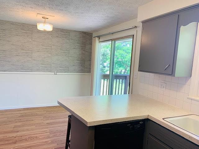 Kitchen with dining area and breakfast bar.