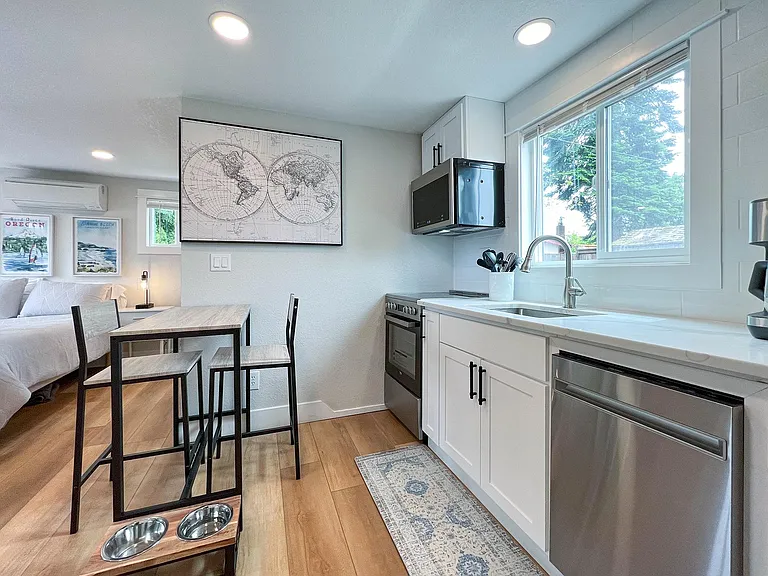 extra deep full sized sink, garbage disposal, dishwasher, built in microwave and range