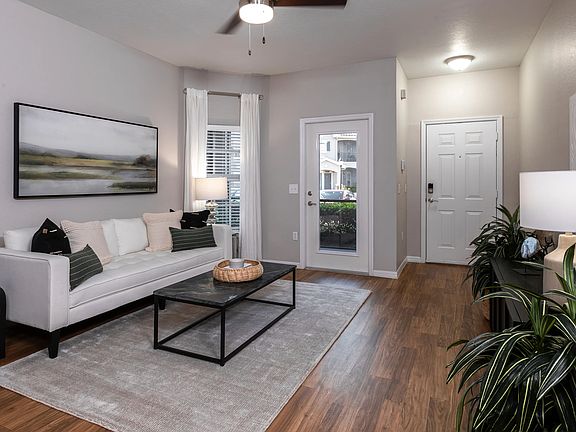A sophisticated living space with stylish decor, a neutral color palette, and an inviting atmosphere.
