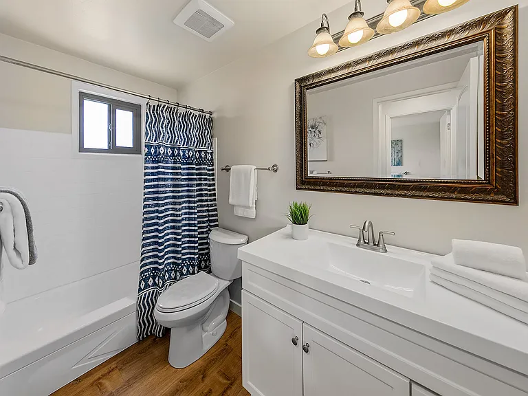 Updated bathroom with new vanity and toilet.