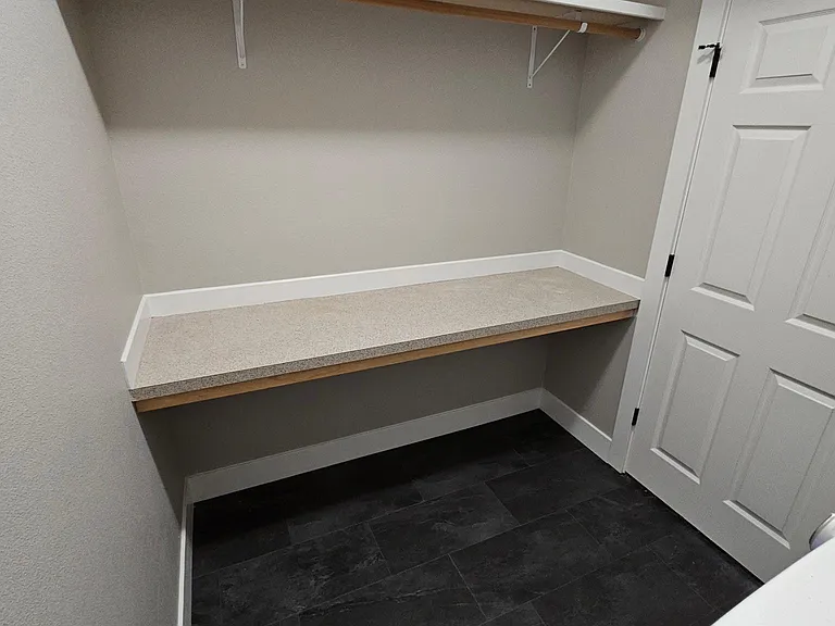 Extra storage and hanging space in laundry room