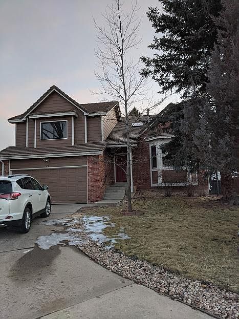 Front exterior with brick and wood siding. Master suite on entire level above 2-car garage. Garage has automatic door opener and keypad. Red oak shade tree is magnificent in the fall.