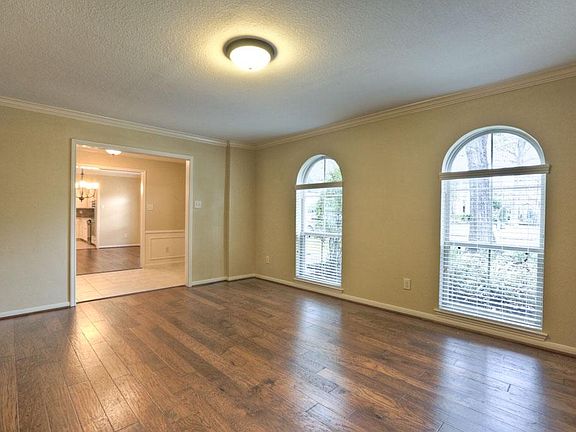 Versatile formal living room could easily convert to an impressive home office.