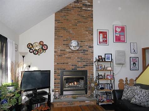 Living Room with Brick Fire Place