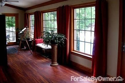 Beautiful Sun room : Tiger wood floors- Lots of natural light - sun room overlooks pool