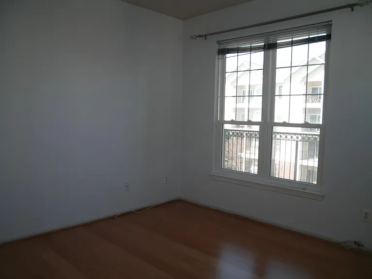 Bedroom with hardwood floors.