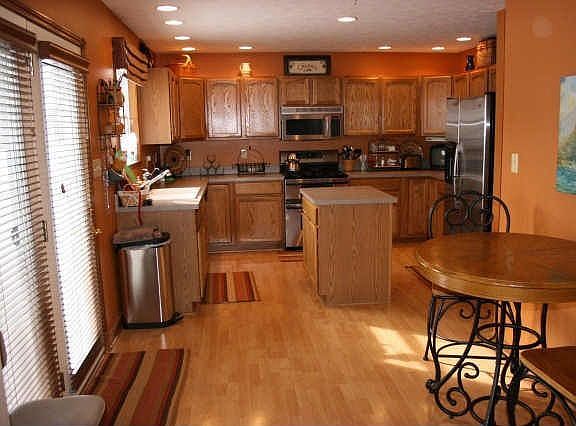 Spacious kitchen and nook with stainless steel applicances.