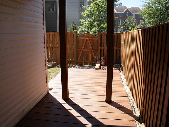Basement walk-out patio and back fence.