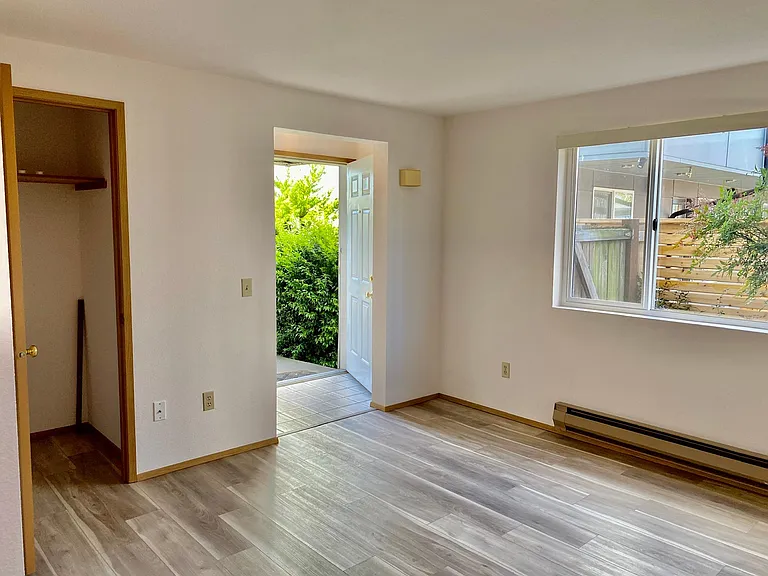 Unit entrance, closet. Hardwood floors.