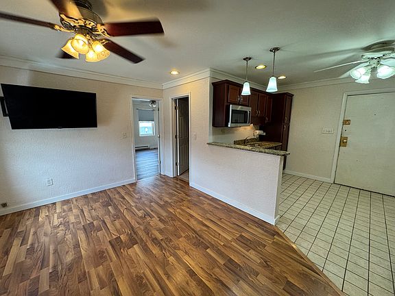 Open concept LR looking into bath and kitchen