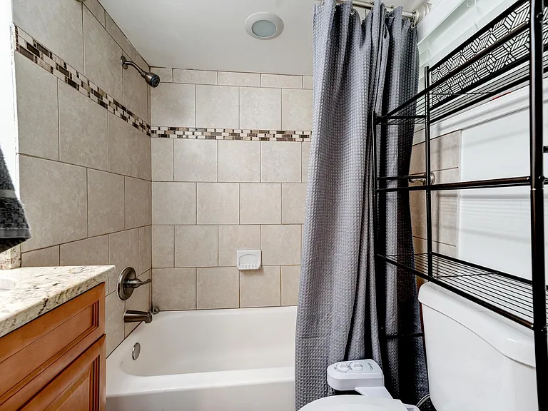 Great bathroom storage; bidet + tub and shower!