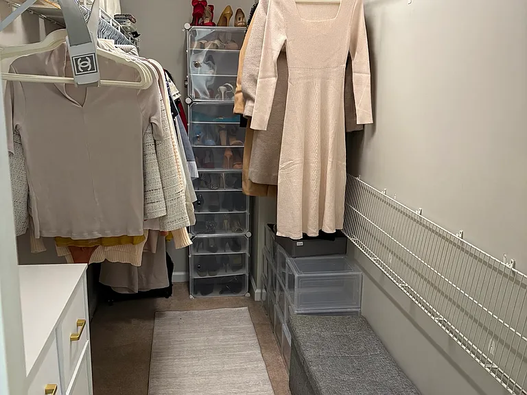 Large walk-in closet with generous storage, built-in organization, and flexible space designed to comfortably accommodate wardrobe, accessories, and everyday functionality.