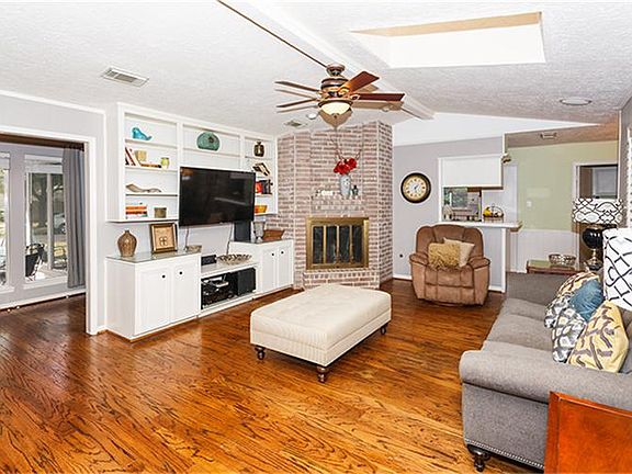 Gorgeous hardwoods in Den, as well as a charming fireplace!