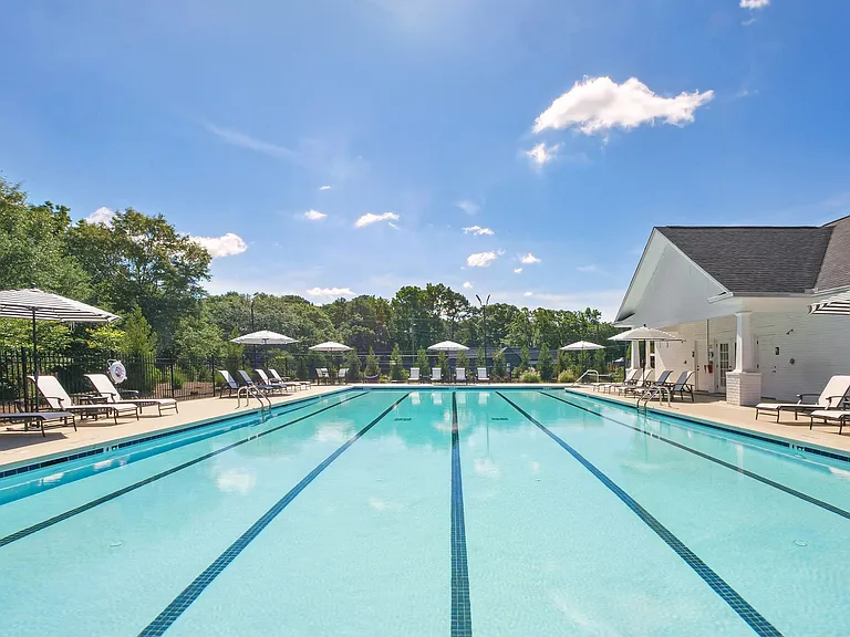 Resort-inspired pool area with stylish lounge seating.