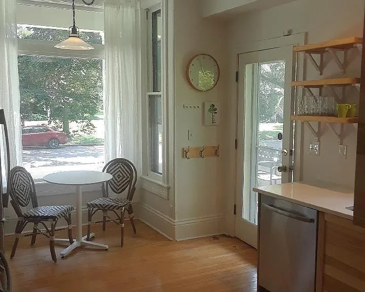 Enter from the wrap around porch into the newly remodeled kitchen with a south facing window eating nook.