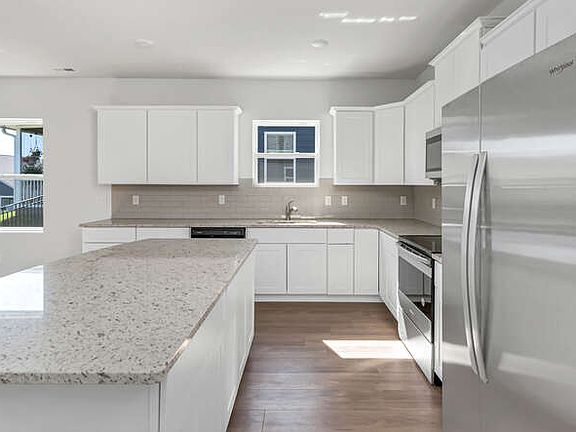 Large bright kitchen with new appliances