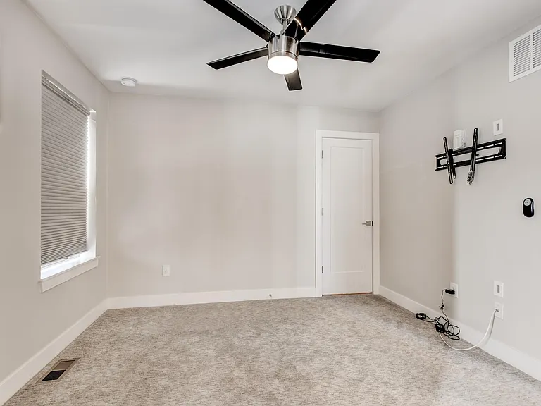 Primary bedroom with TV wall mount, walk-in closet and en-suite full bath.