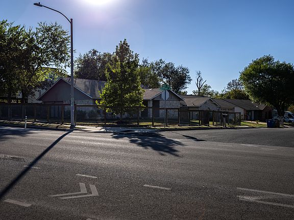 Completely fenced in large corner lot.