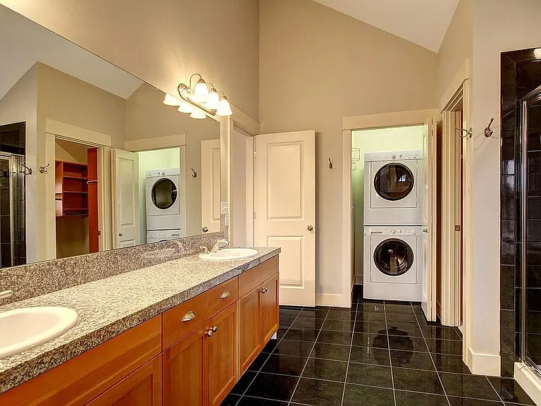 Master bathroom with washer, dryer, jettub and walk-in close