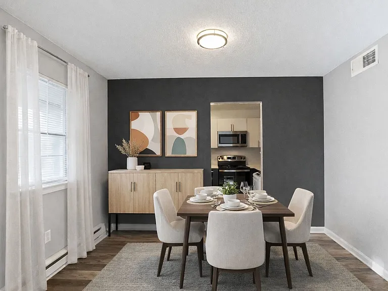 Welcome to Hamilton Estates Apartments, where modern elegance meets comfort. This inviting dining area features stylish decor and a seamless flow into the kitchen, perfect for gatherings. Elevate your living experience todayschedule a tour now!