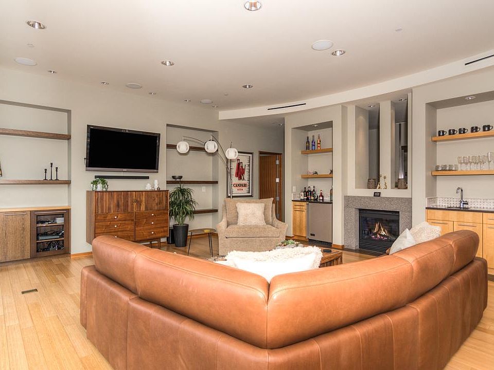 Living room with gas fireplace and bar