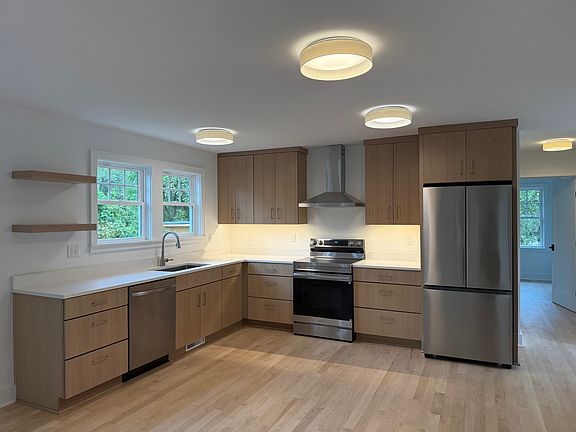 Bright kitchen with tons of storage and open plan to allow for any kitchen table