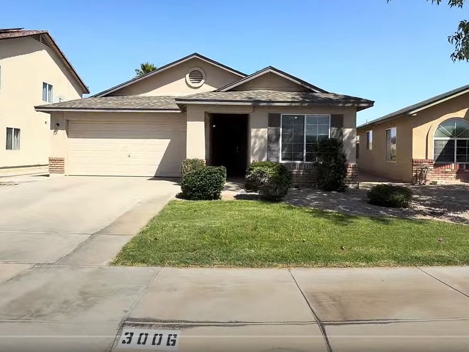 It has a beautiful yard and entryway.