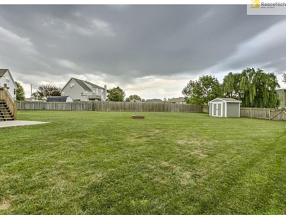 Very spacious fully fenced lot with shed and fire pit
