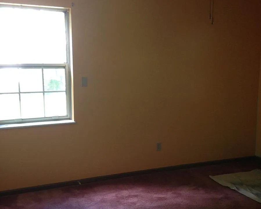 One of the Three Bedrooms