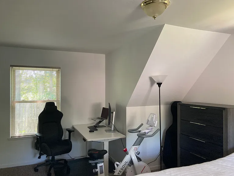 Bedroom with sloped ceilings.