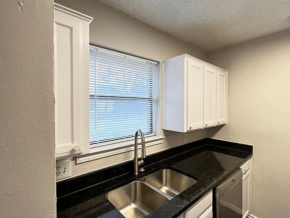 Kitchen with laundry hookups, new stove, new gas stove/oven