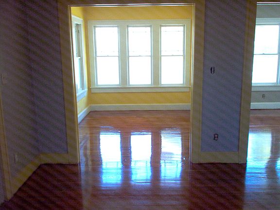 Looking east from living room towards sun room and bedrom of