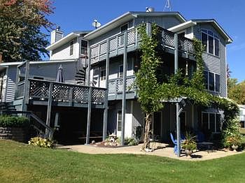 ONE OF A KIND WATERFRONT HOME! Major addition and remodel in 95. A second story and guest suite added. The suite has a master with a bath, living rm., kitchen, and it's own basement for storage and separate furnace. The main house has 3 bedrooms up and the master has WIC,full bath, and space for a sitting area and a deck. Main floor laundry, wood burning fp. Hardwood and ceramic floors as well.