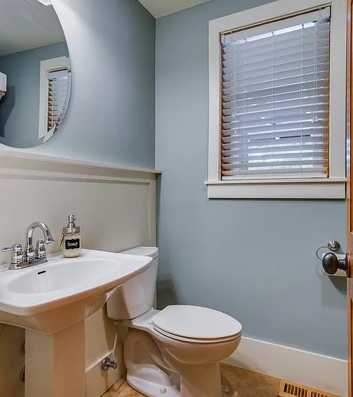 Hall half-bath in downstairs cabin next between kitchen and cabin living room.