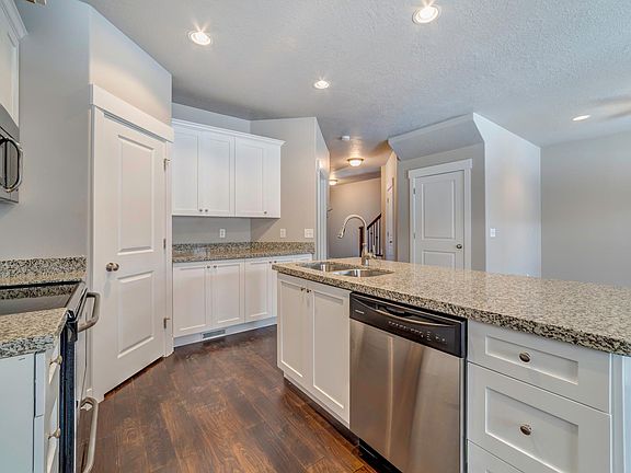 Kitchen with stainless Steel appliances. New stainless steel French door fridge (not shown)