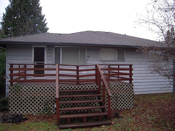 Back of home with deck