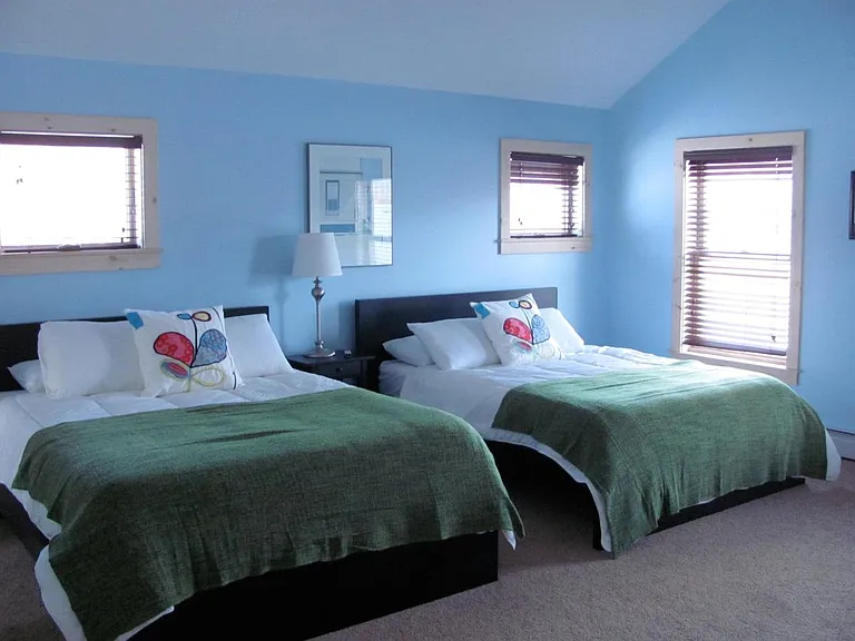 Second floor bedroom with two queen beds and a in suite ful