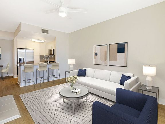 Renovated Package I living room with hard surface flooring