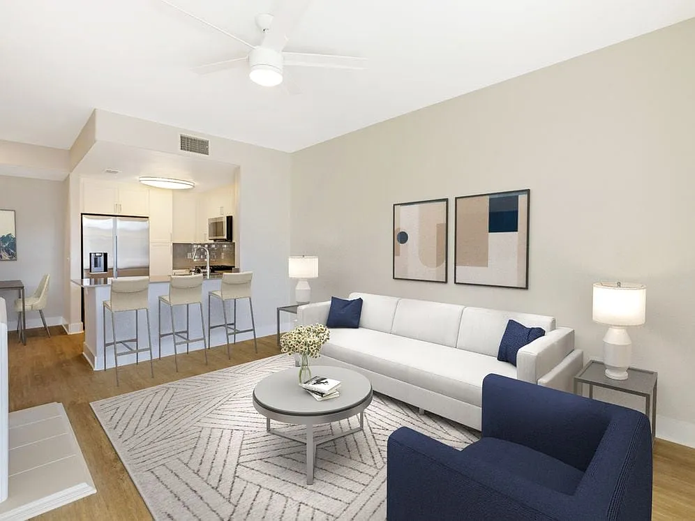 Renovated Package I living room with hard surface flooring - Avalon Oak Creek