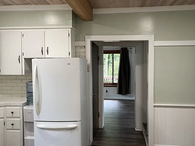 The kitchen leads to the pantry on the left. The living room is straight ahead. First hall is to the bathroom of the left. Next left leads to the second floor.