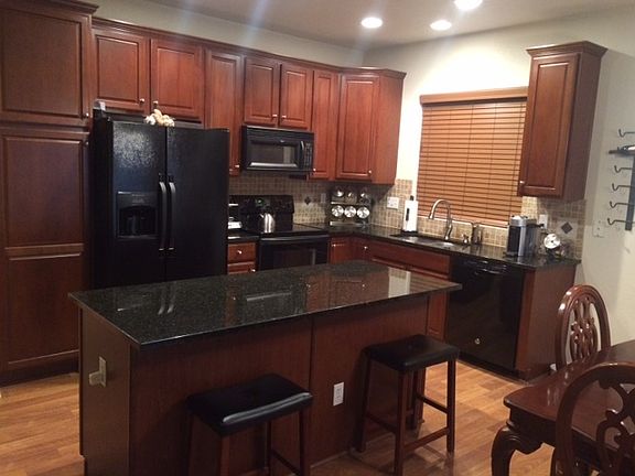 Upgraded Kitchen : Cherry wood cabinets, granite countertops, new faucet and stainless steel sink.