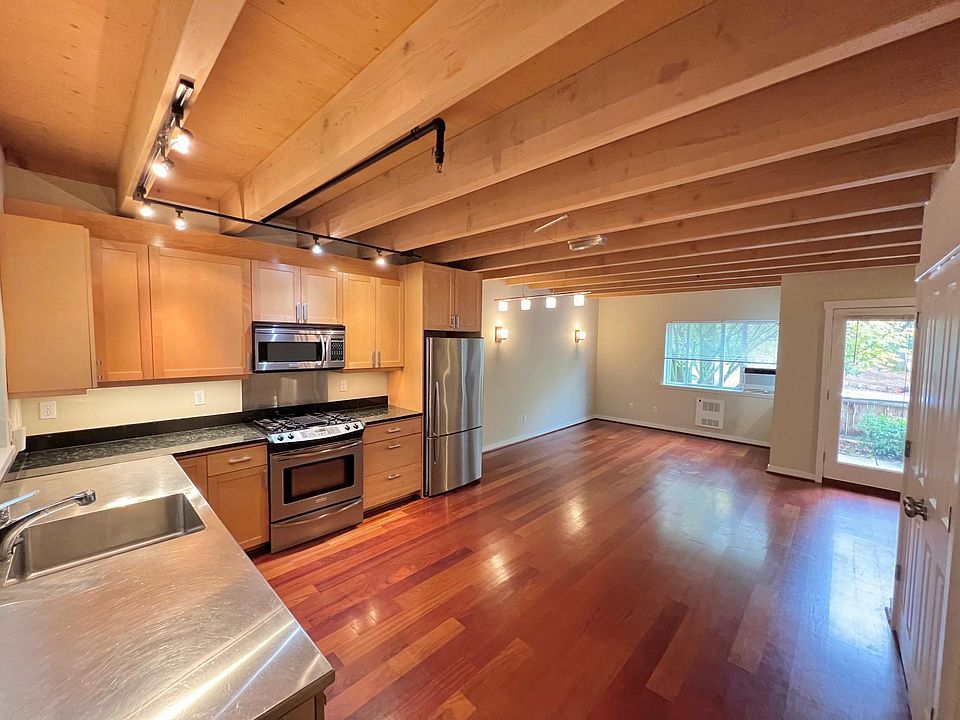 Kitchen/dining and 1st living room space. Large pantry to the left. Powder room is on this level is also just to the left. All stainless steel appliances. A separate entrance from the basement garage leads up to this main ground level.