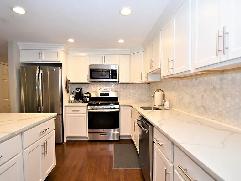 Kitchen with Fridge, Gas stove with Air Fry mode, dishwasher and beverage fridge built into the island (not pictured)