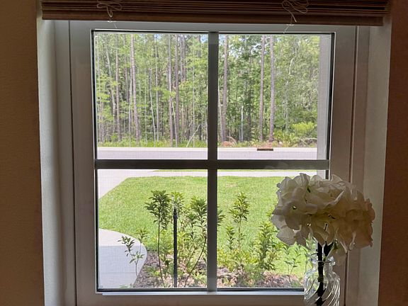 See the protected wooded preserve across the street.